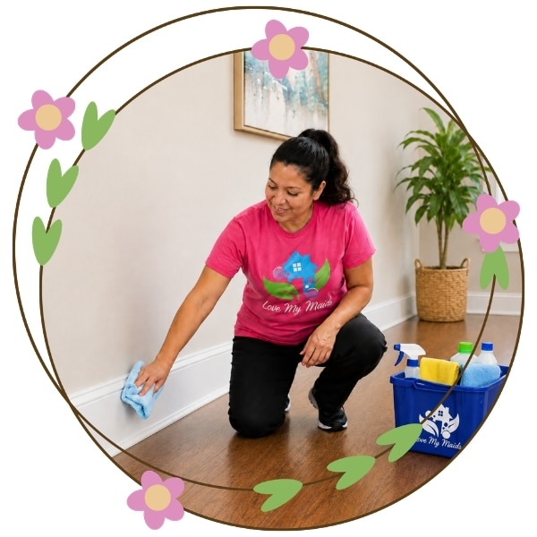 I house cleaner washing baseboards during a deep house cleaning service